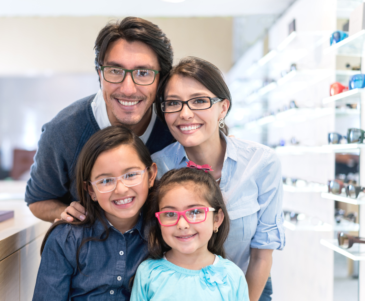Family buying glasses at the optician's shop